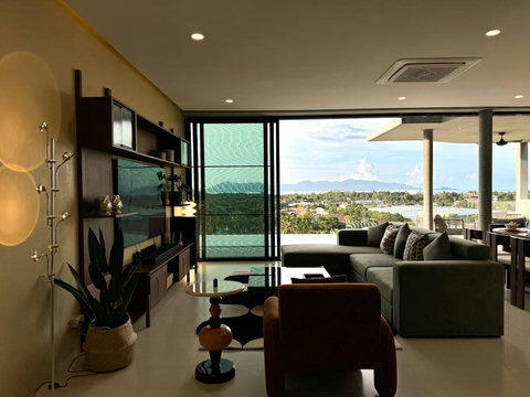 Spacious indoor-outdoor living space overlooking the hills and coastline of Koh Samui.