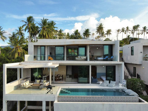 Spacious pool terrace with direct access to the villa’s open-plan living and dining areas.