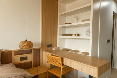 Dedicated workspace with rattan chair, ideal for remote work during your stay