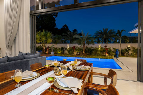 Peaceful tropical garden and private pool illuminated for magical evenings.