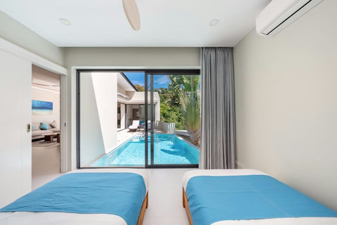 A clean, well-designed bedroom with everything you need for a refreshing start each day.