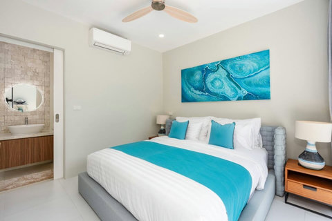 A comfortable bedroom where you can unwind after a day exploring Koh Samui.