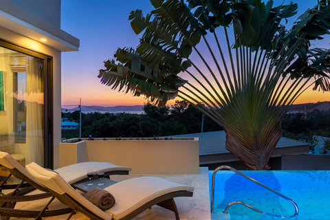 Unwind on the poolside sunbeds in the peaceful evening atmosphere