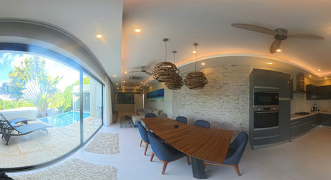 Gather for meals in the bright dining area over overlooking your private pool