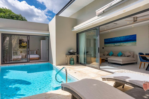Cool off in the pool surrounded by tropical greenery and the sounds of island life.