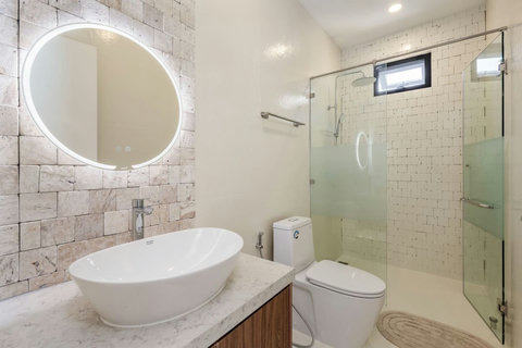 A fresh, clean bathroom with modern shower and all the toiletries you need.