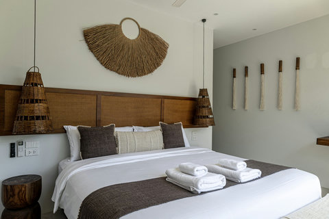 King bed with folded towels ready for you