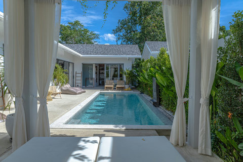 View from the daybed cabana across the pool to the villa