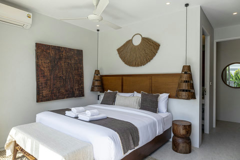 King bedroom with bedside stool