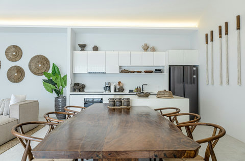 Dining table with coffee station behind
