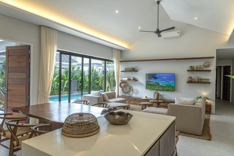 Kitchen island looking to the living room and pool