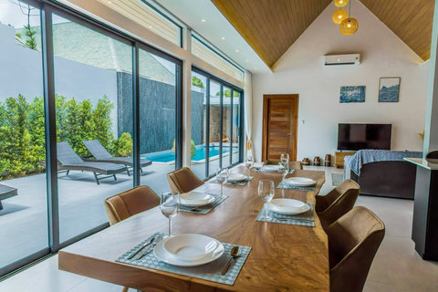 Breezy, light-filled living space. The windows frame your view while ceiling fans keep air flowing.
