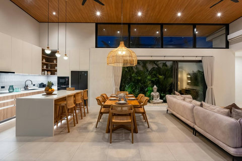 Step into a spa-like ensuite where rain showers pour down and tropical air flows freely.