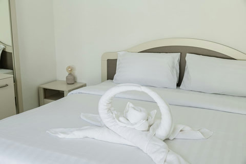 Comfortable double bed prepared with fresh linens and towels for your arrival.