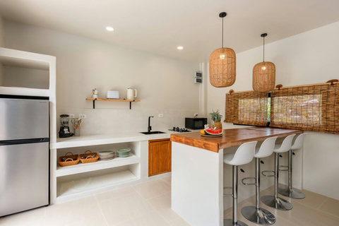 Relax in the bright, airy living space where soft natural light invites you to unwind.