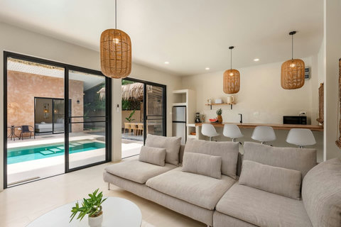 Notice the thoughtful details, from water features to vibrant tropical plantings.