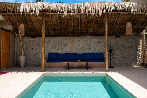 As dusk falls, the villa glows warmly, inviting you to settle in for the evening.