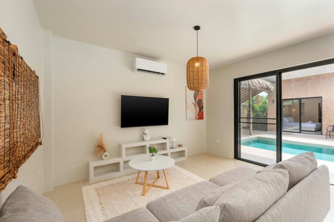 Immerse yourself in the lush tropical garden that encloses your private villa.