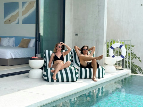 Relax by the private infinity pool with comfortable loungers and direct access to the villa.