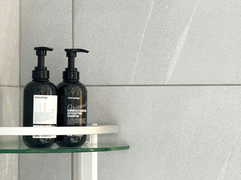 Bathroom amenities with shampoo and body-care products provided for guests.