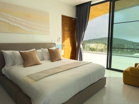 right king bedroom opening onto beautiful tropical and hillside views.