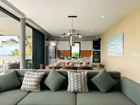 Comfortable living room connected to the open-plan kitchen and dining area.