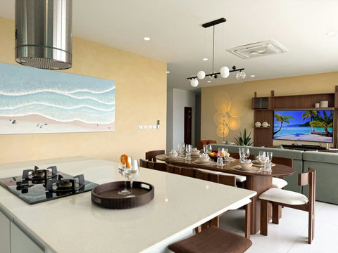 Spacious open-plan kitchen, dining and living area with a modern design and plenty of natural light.