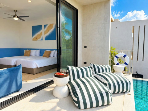 Modern Poolside BedroomRelax beside the infinity pool with comfortable loungers just steps from the Retreat (1)
