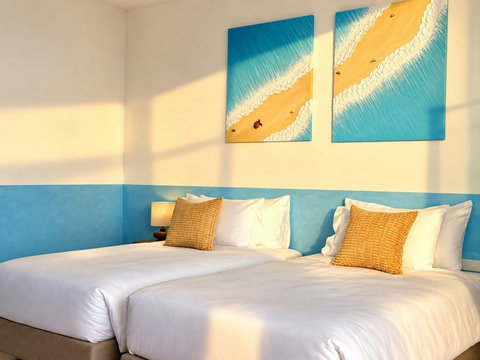 Bright twin bedroom with comfortable beds, air conditioning and warm natural