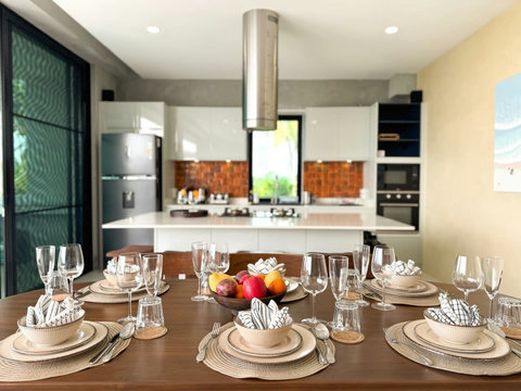Elegant dining area beside the fully equipped kitchen, perfect for meals with family or friends.