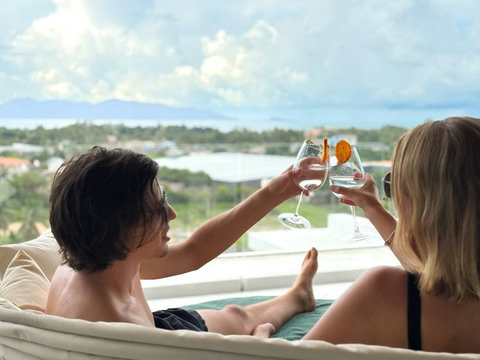 Relax with a drink while enjoying the panoramic sea and tropical views from Villa La Lay.