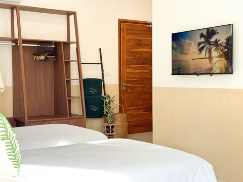 Comfortable twin bedroom with wardrobe, Smart TV and plenty of natural light.