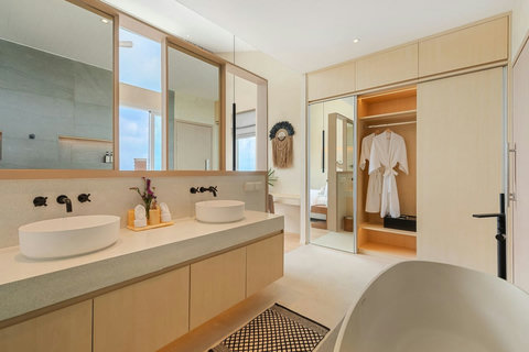 Double vanity, walk-in wardrobe and bathrobes