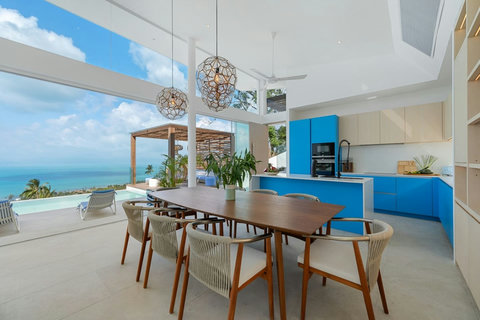 Dining table for 6 with views over the pool and sea