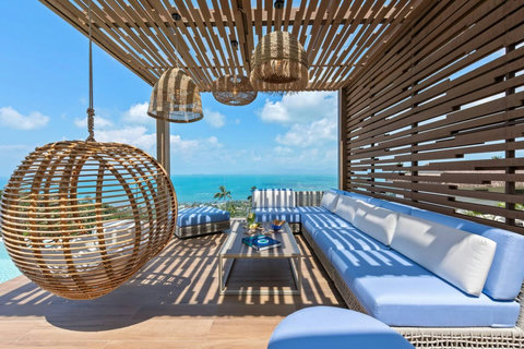 Shaded sala with hanging rattan chair