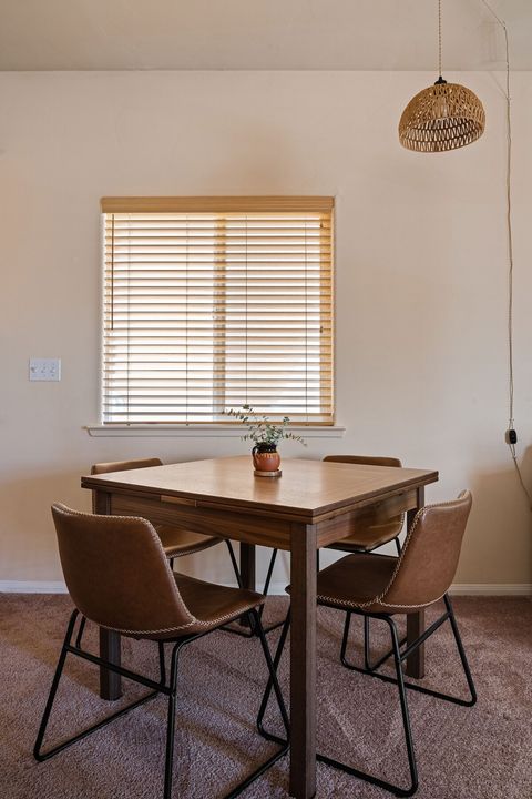 Beautiful Scandinavian Designs table that can pull out into a six-person table for larger groups. We keep it at a seating for four by default. Two extra folding chairs are located in the pantry. 