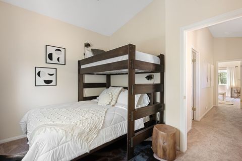 Single bunk bed over queen bed. This room is perfect for a couple or a family with kids. Can sleep 3 comfortably.