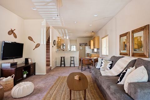 Wide open concept livingroom has a smart TV with Roku in guest mode. Family games are stocked in the entertainment center for younger kids to reach and pantry area for adults to reach. 
