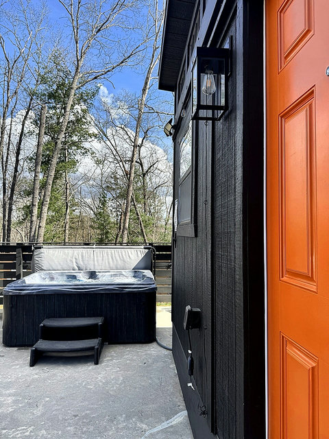You'll know it when you see it — the signature orange door welcomes you home.