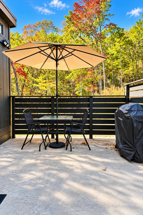 Morning coffee on your private patio with nothing but treetops and mountain air