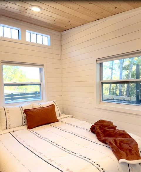 Sink into a plush queen bed after a long soak — quiet nights on the ridge