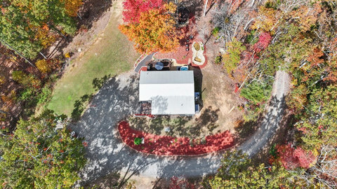 A bird’s-eye view of the Casita’s private setting, surrounded by trees and dedicated outdoor amenities.