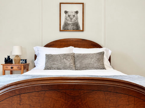 Full-size bed with white bedding in Casita’s second bedroom in Blue Ridge, Georgia.