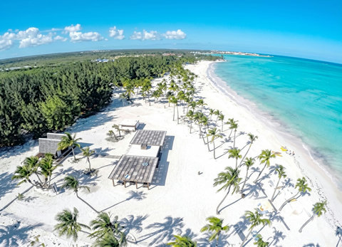 Secluded palm-fringed beachfront retreat on powder-white sands, turquoise sea views  10 minutes away