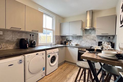 Fully equipped communal kitchen with microwave, kettle, washing machine, dryer, toaster, air fryer, crockery, cutlery, wine glasses, cooking pans, utensils, coffee maker