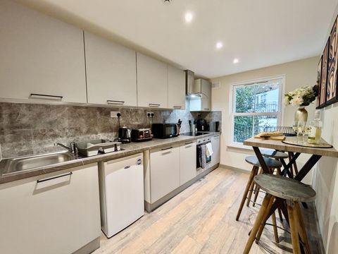 Fully equipped communal kitchen with microwave, kettle, washing machine, dryer, toaster, air fryer, crockery, cutlery, wine glasses, cooking pans, utensils, coffee maker