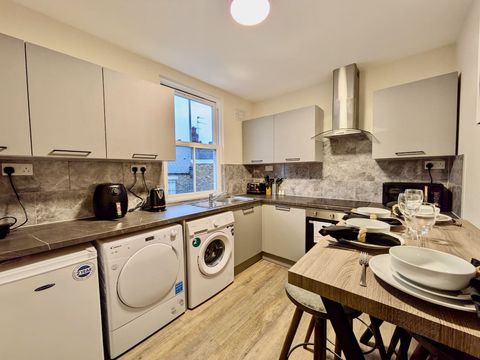 Communal kitchen with microwave, kettle, washing machine, dryer, toaster, air fryer, crockery, cutlery, wine glasses, coffee maker