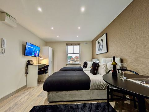 Choose between two twin beds or a luxurious super-king bed in this inviting room. It offers a 40" Smart TV with Netflix, complimentary WiFi, a dining area, a workspace, an ensuite bathroom, a wardrobe, hangers, and a hair dryer.