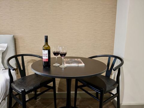 Chic Dining area perfect for cozy meals or lively conversations, offering a welcoming space to relax and enjoy memorable moments