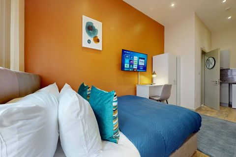 Stream your favorite shows on a 40" Smart TV, stay connected with WiFi, and enjoy a cozy kitchenette with tea & coffee. A dedicated workspace and private patio offer the perfect balance of productivity and relaxation.